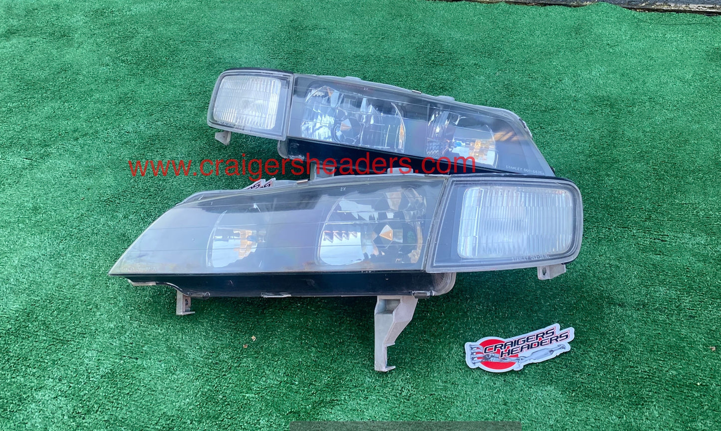 1994-1997 Honda Accord JDM Stanley Headlights. (Black Housed)